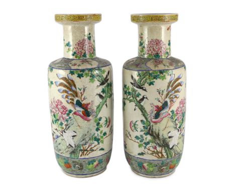 A pair of large Chinese crackle glaze famille rose ‘Hundred Bird’ rouleau vases, late 19th century, each painted with a conti