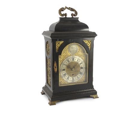 Hughes of London. A 19th century ebonised chiming bracket clock with domed rectangular case with elaborate cast brass caryati