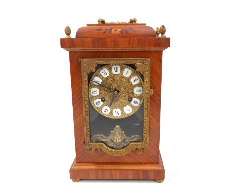 HERMLE; a German mantel clock with marquetry detail and gilt metal mounts, the circular dial set with Roman numerals, the bac