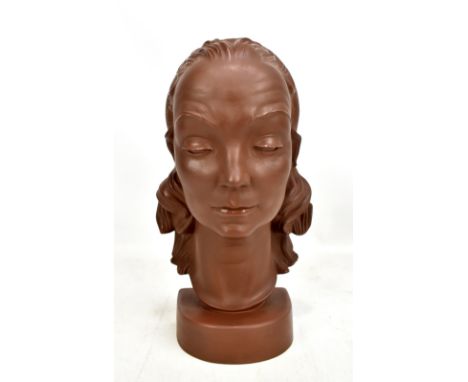 MEISSEN; a brown glazed portrait bust of a young woman modelled by Emil Paul Börner, with incised marks and also stamped 'Bot