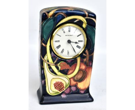 MOORCROFT; a 'Queen's Choice' pattern tube line decorated clock on navy ground, impressed marks, WM monogram and indistinct y