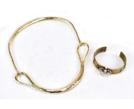 YVES SAINT LAURENT; a gilt metal choker necklace of two part construction, width 16.7cm and a bangle, both with hammered fini