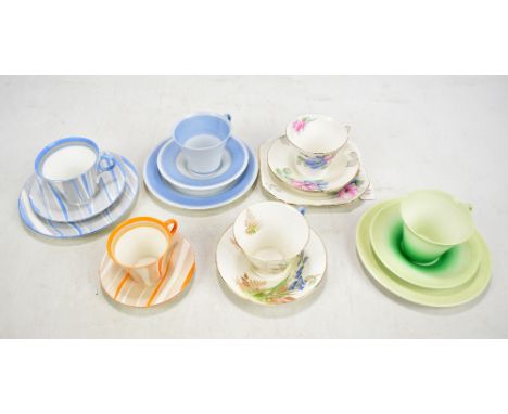 SHELLEY; four 'Regent' shape trios in various patterns including 12486, 12334 etc together with two teacups and saucers patte