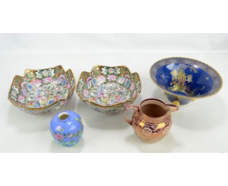 A small group of ceramics comprising a Carlton Ware blue ground bowl with enamelled and gilt chinoiserie decoration on three 