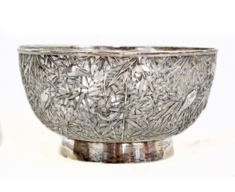 CHONG WOO OF HONG KONG; a c1900 Chinese export silver pierced circular bowl modelled as birds in relief perched amongst bambo