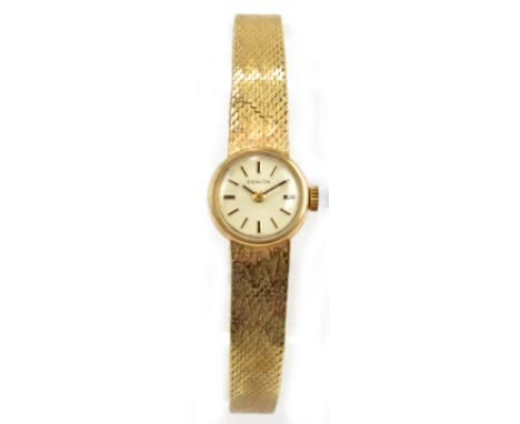 ZENITH; a lady's vintage 9ct yellow gold wristwatch with circular dial set with gold batons on integral gold bracelet, approx