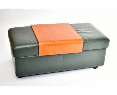 EKORNES; a green leather combination table/pouffe.