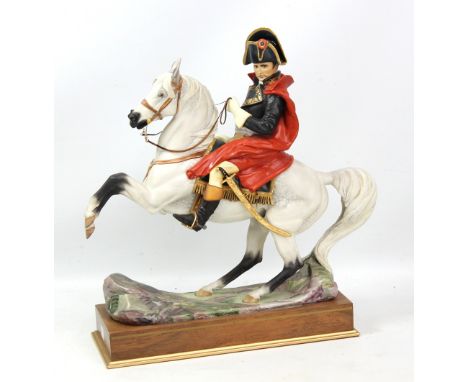 ROYAL WORCESTER; a large figure, 'Napoleon Bonaparte', mounted on a rosewood and brass inlaid plinth, height including plinth