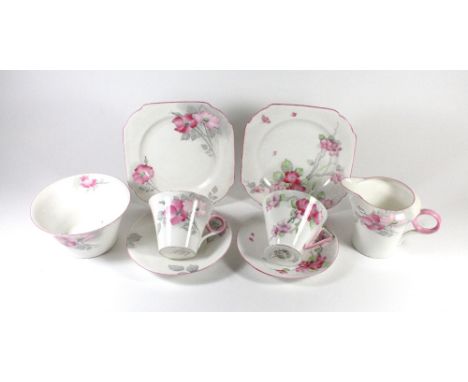 SHELLEY; an Art Deco 'Eve' shape trio in the 'Apple Blossom' pattern together with milk jug, sugar bowl, teacup and saucer in