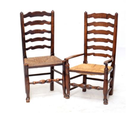 A harlequin set of seven late 19th century ladder back rush seated chairs with turned front legs united by turned stretchers,
