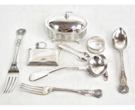 A late Victorian hallmarked silver napkin ring, Birmingham 1897, a hallmarked silver table fork and small fork, a silver purs