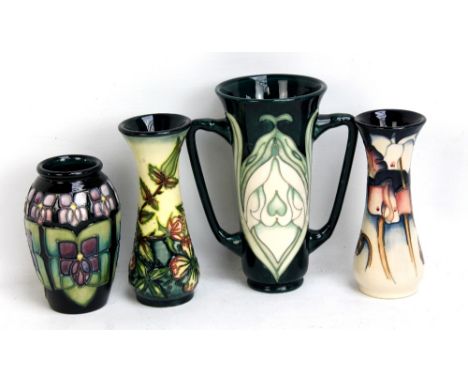 MOORCROFT; four floral tubeline decorated vases including a twin handled Moorcroft Collectors' Club example, height 15cm, all