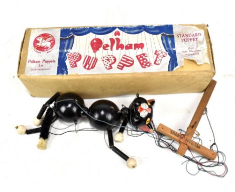 A Pelham cat puppet in associated Pelham box.