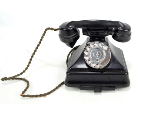 A vintage bakelite telephone, height 20cm.