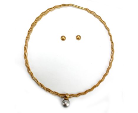 An 18ct matt gold necklace with pearl drop set with a diamond, with a pair of matching ear studs, combined 18.8g, presented i