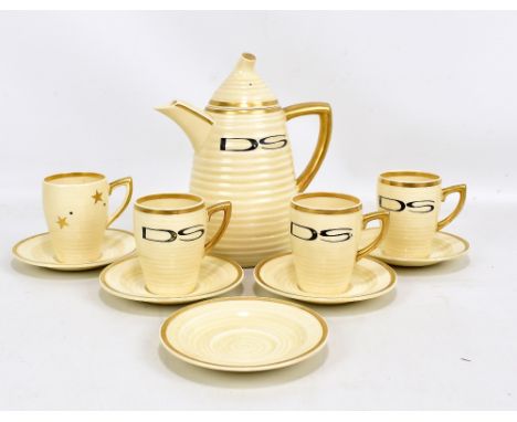 CLARICE CLIFF; a Wilkinson Ltd 'Lynton' shape cream glaze and gilded coffee set comprising a coffee pot, four coffee cans, an