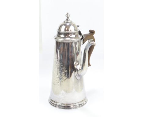 A good George I hallmarked silver coffee pot, the hinged domed lid above shaped wooden handle and side spout with hinged lid 