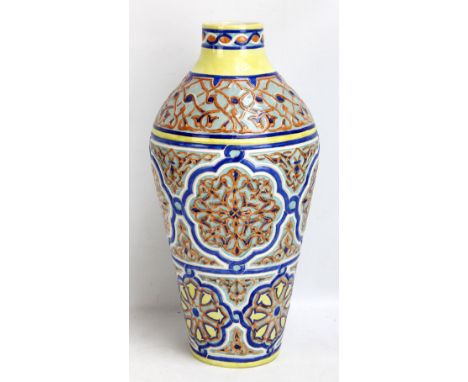 A large decorative ovoid vase decorated in shades of yellow, blue, green and ochre, painted marks to base, height 53cm.Additi