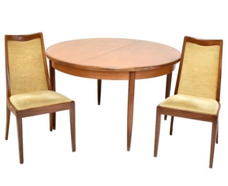 G-PLAN; a circular extending dining table and four chairs with padded backs and seats (5).Additional InformationLight surface