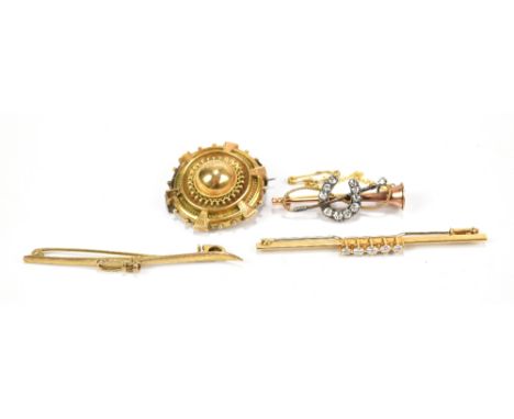 A 9ct yellow gold novelty brooch in the form of a ski, a diamond five stone set brooch, a brooch in the form of a hunting hor