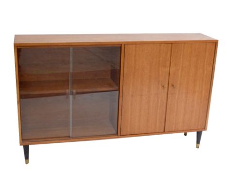 A teak bookcase with a pair of sliding doors flanked by further doors.Additional InformationLight wear and dirt.