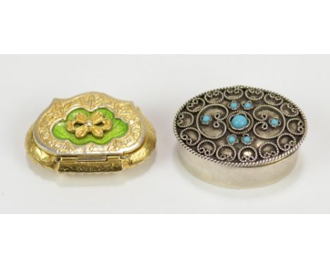 INTERNATIONAL BULLION &amp; METAL BROKERS; a silver gilt pill box of shaped outline with enamel detail to lid and engraved fo