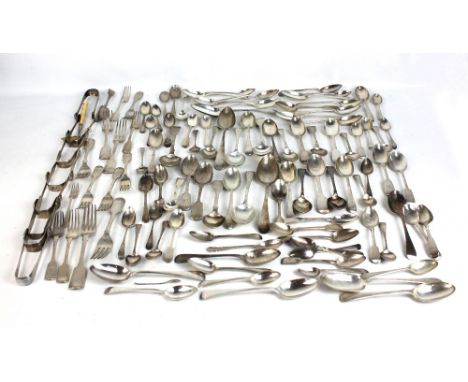 A large quantity of hallmarked silver flatware including table forks, small forks, serving spoons, dessert spoons, eight pair