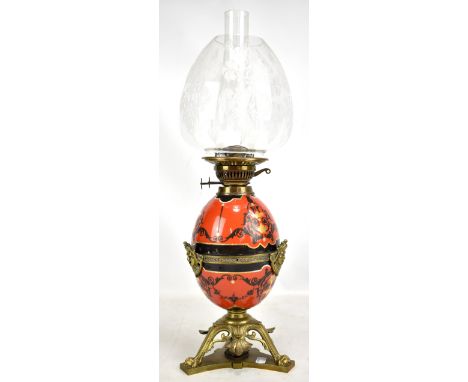 An unusual 19th century oil lamp with etched ovoid shade, egg shaped main body and set within a pierced brass frame, height i