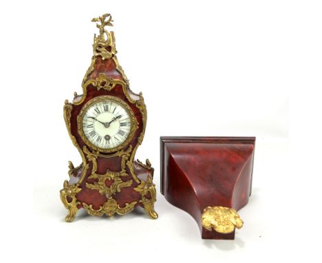 A late 19th century gilt metal and tortoiseshell mantel clock, the porcelain dial set with Roman and Arabic numerals, the mov