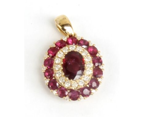 A 14ct yellow gold ruby and diamond oval pendant, length 2.3cm including bale, sold with World Gemological Institute gem repo
