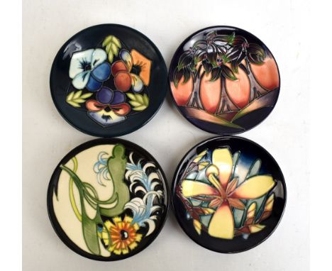 MOORCROFT; four Moorcroft Collectors' Club tubeline decorated navy ground dishes, all with impressed marks and various year c