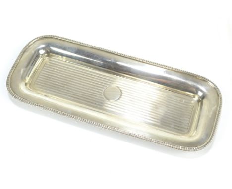 WILLIAM HUTTON &amp; SONS; an oval hallmarked silver dressing table tray with engine turned detail and vacant cartouche,&nbsp
