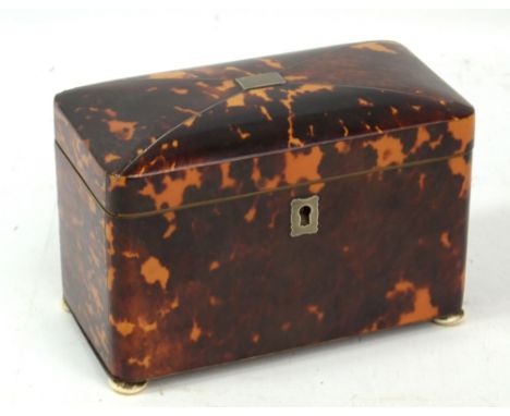 A 19th century tortoiseshell two division tea caddy of rounded rectangular form with pewter stringing and raised on squat ivo