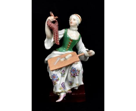 MEISSEN; a mid-18th century figure of the lady street cook modelled by J.J. Kaendler circa 1750, height 16.5cm.
Provenance: f