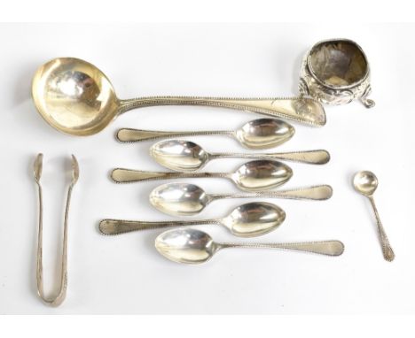 A group of small silver including a Victorian hallmarked silver sauce ladle, London 1864, an open salt, teaspoons, a salt spo