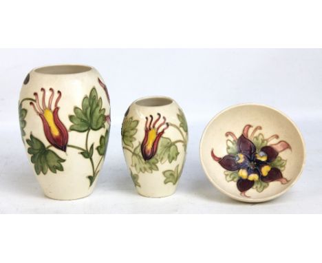 MOORCROFT; two floral tubeline decorated vases and bowl, all on cream ground and with impressed marks to bases, the larger va