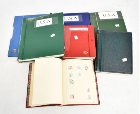 UNITED STATES OF AMERICA; 1850s-1980s collection in seven albums or sketch books, mint and used including coils, pre-cancels,