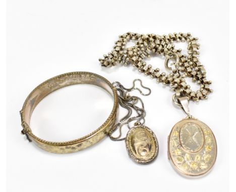 A Victorian hallmarked silver chain supporting a floral detailed oval locket engraved with the initials BB and dated 25-9-92,