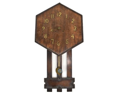 A 1920s oak hexagonal wall clock, length 82c (af).