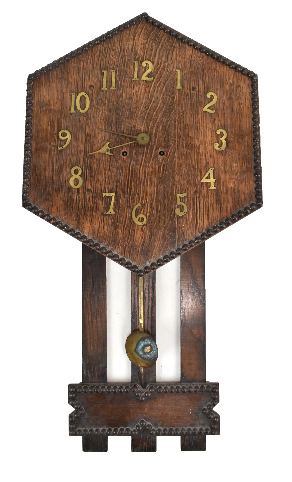 A 1920s oak hexagonal wall clock, length 82c (af).