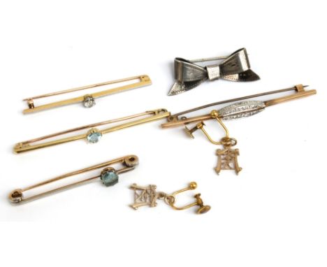 A small group of jewellery comprising an unmarked yellow and white metal bar brooch set with old cut diamond, a yellow metal 