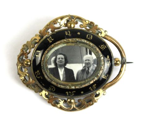 A 19th century yellow metal and enamel mourning brooch, length 6cm (af).