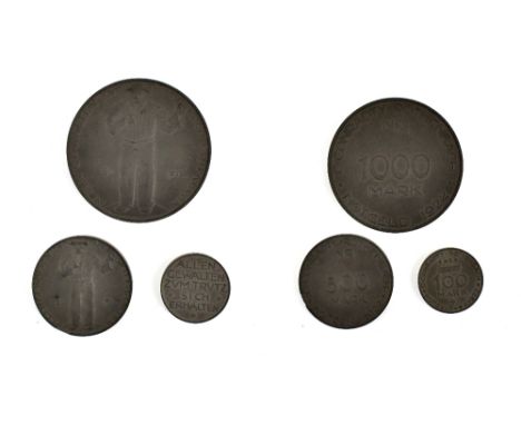 Three German 1922 Notgeld emergency issue coins formed of compressed coal dust, issued by C. Conrady comprising one thousand,