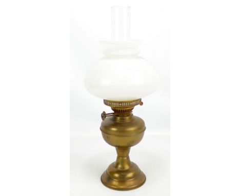 A brass oil lamp with duplex burner, clear glass chimney and opaque white glass shade, height 48cm.Additional InformationGene