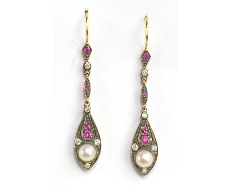 A pair of drop earrings set with rubies, diamonds and a pearl.