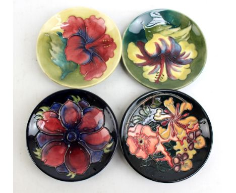 MOORCROFT; four floral tubeline decorated pin dishes including two 'Hibiscus' pattern examples (other two second quality), di
