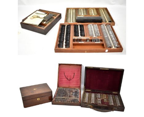 A set of vintage optician's testing equipment, a further cased example, rosewood box, etc.