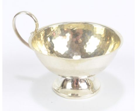 K &amp; E CARLSON; an early to mid-20th century Swedish silver christening cup with hammered surface&nbsp;on spreading circul