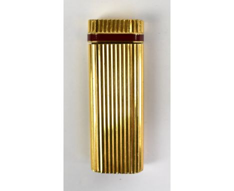 CARTIER; a ribbed lighter with band of enamel decoration and stamped to base 'Cartier Paris 55001V', height 7cm, sold in Cart