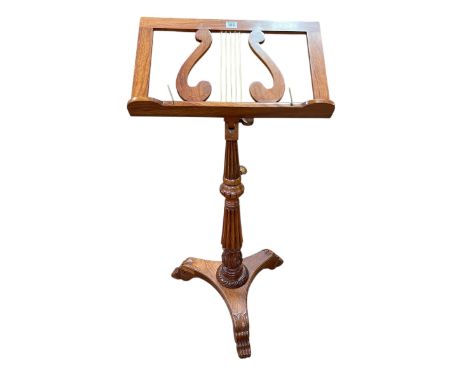 Regency style fluted column music stand on triform base.